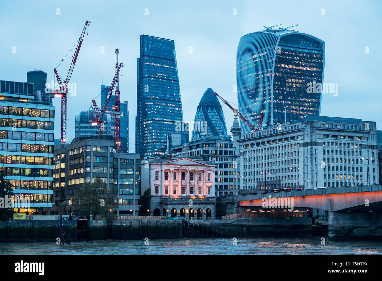 The City Walkie Talkie Gherkin Cheesegrater Thames London Bridge at Dusk Stock Photo