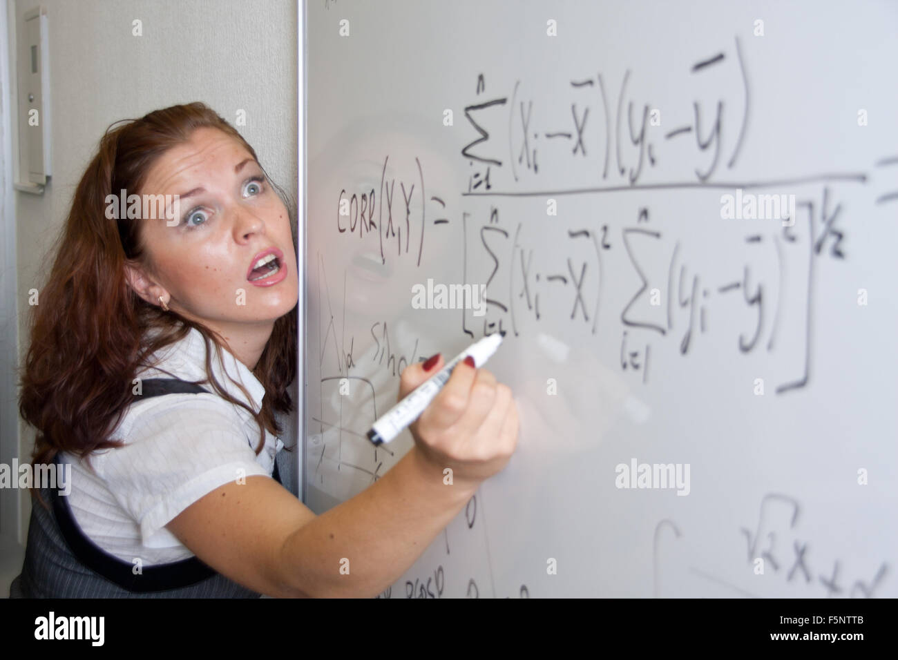 Shocked student. Crazy mathematical formulas Stock Photo - Alamy