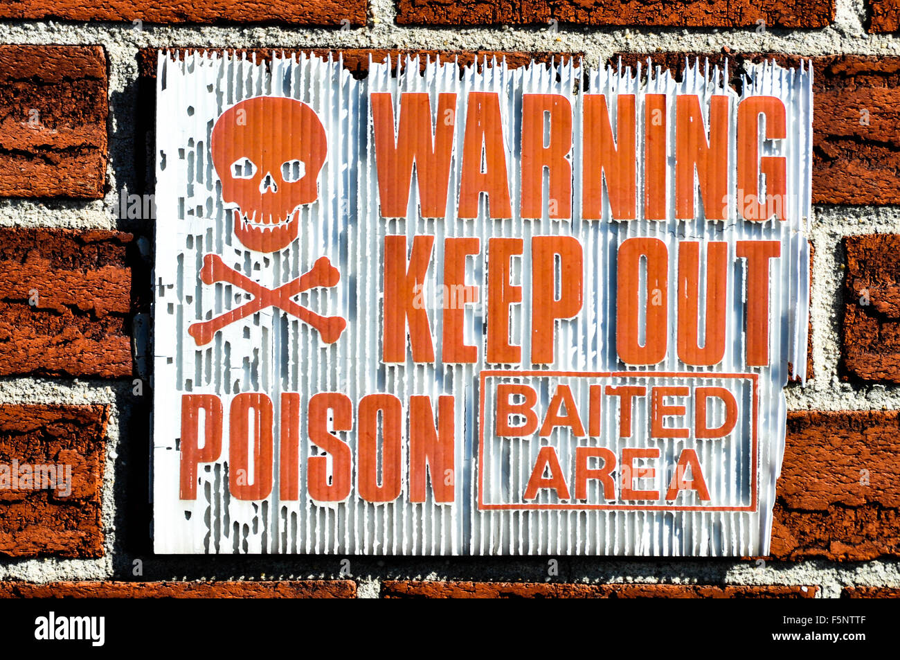 red, 'warning keep out poison baited area'sign Stock Photo