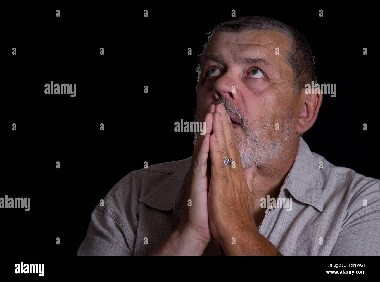 Senior citizen praying hi-res stock photography and images - Alamy
