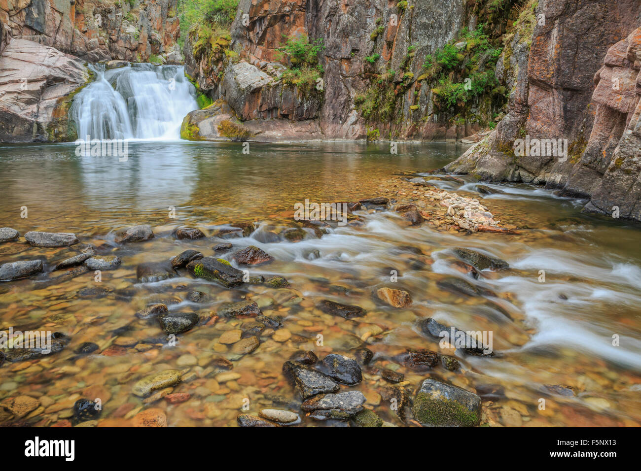 waterfall on tenderfoot creek in the little belt mountains near white