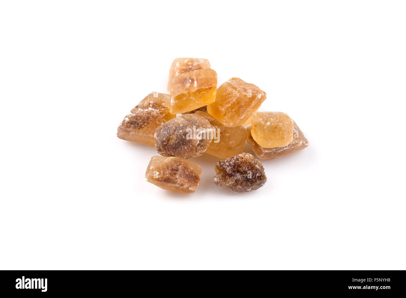 Brown caramelized lump cane sugar cube isolated on white background cutout Stock Photo
