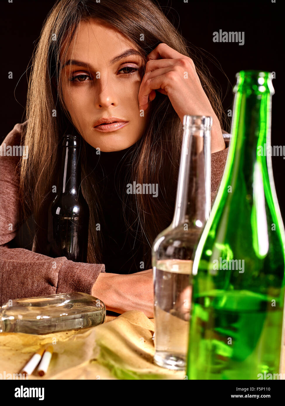 Drunk girl holding bottle of vodka Stock Photo Alamy