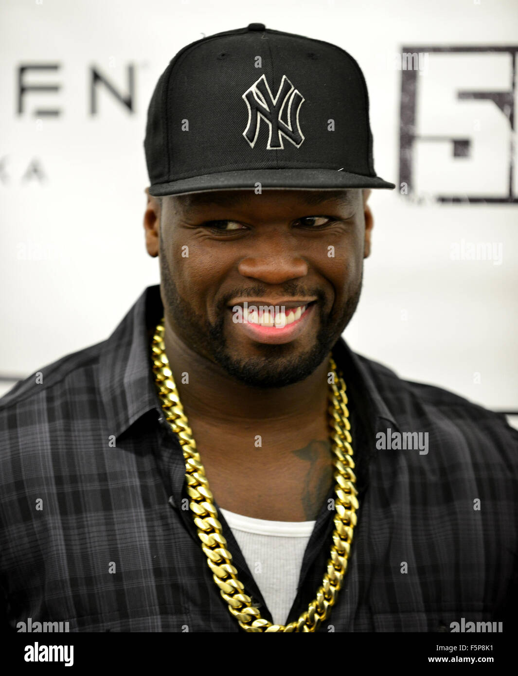 Curtis “50 Cent” Jackson signs an Effen Vodka bottle at Crown Wine ...