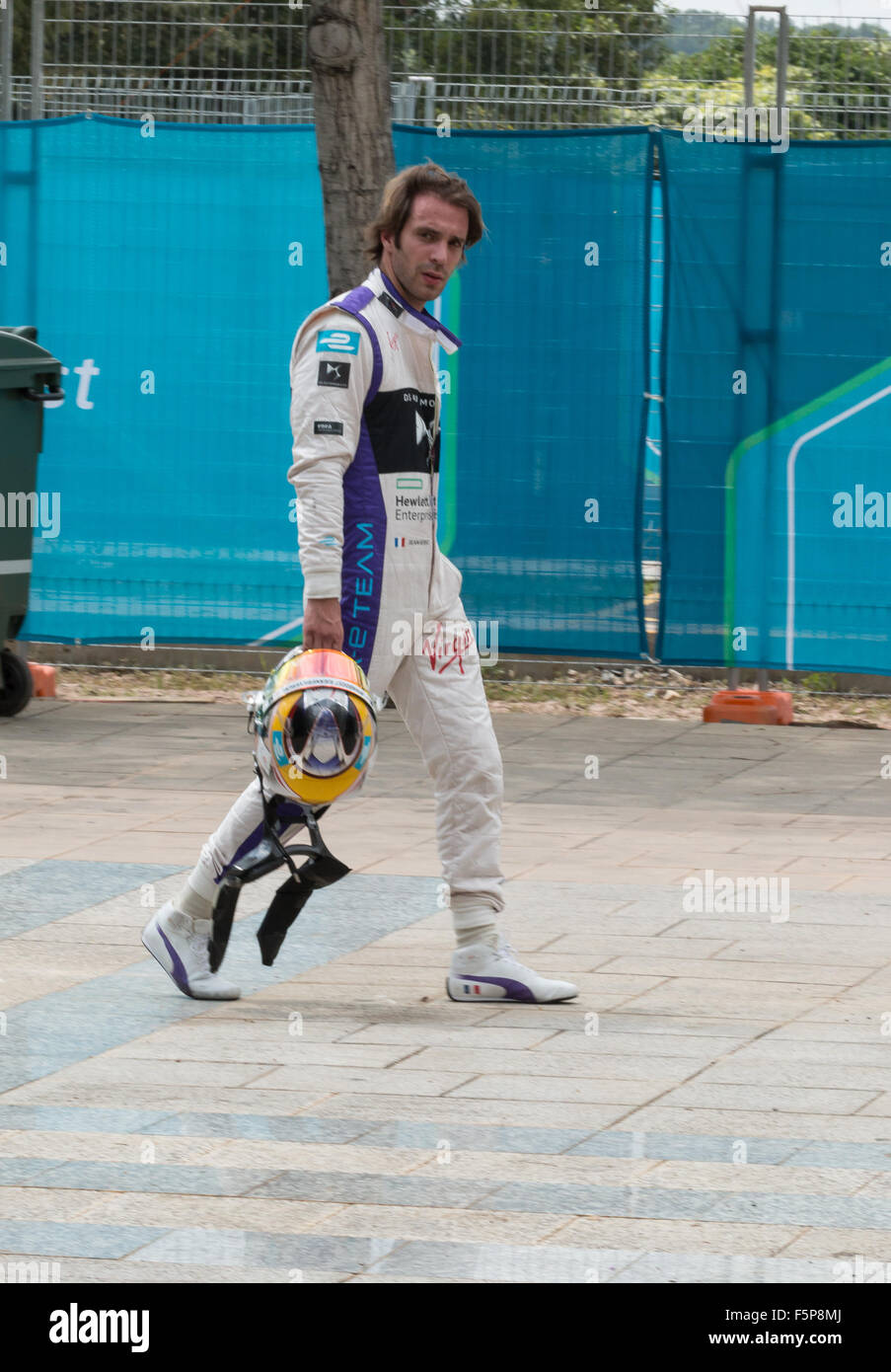 Nick Heidfeld walks back to the pits after a first-lap collision forced his retirement from the 2015 Formula E ePrix in Malaysia Stock Photo