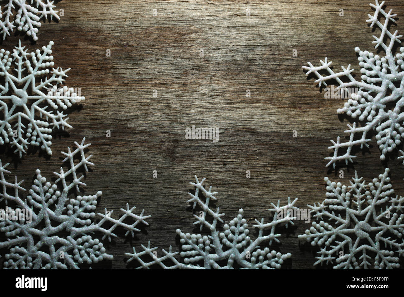 Snowflakes on wooden background Stock Photo