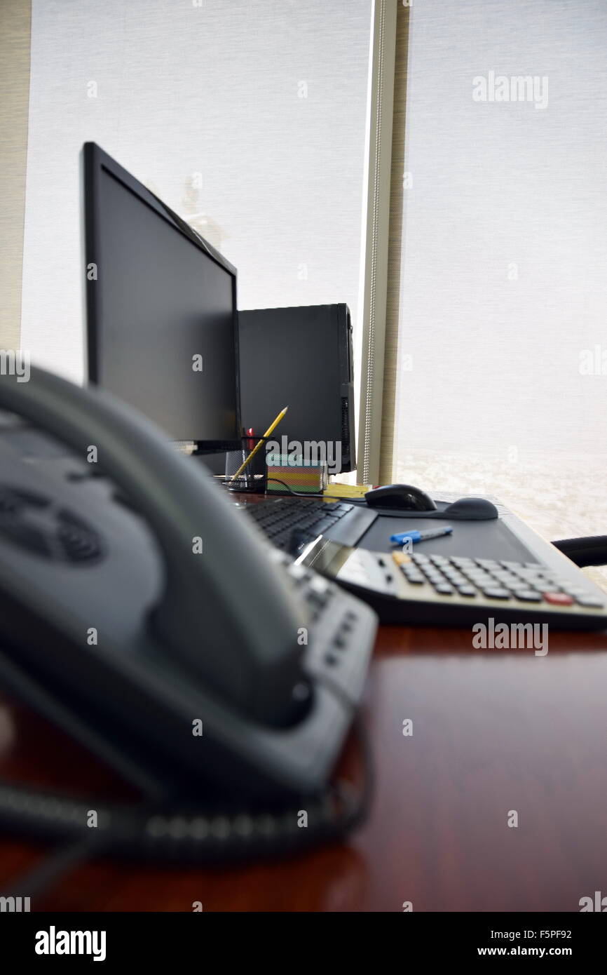 Office desk with computer and other items in the day Stock Photo
