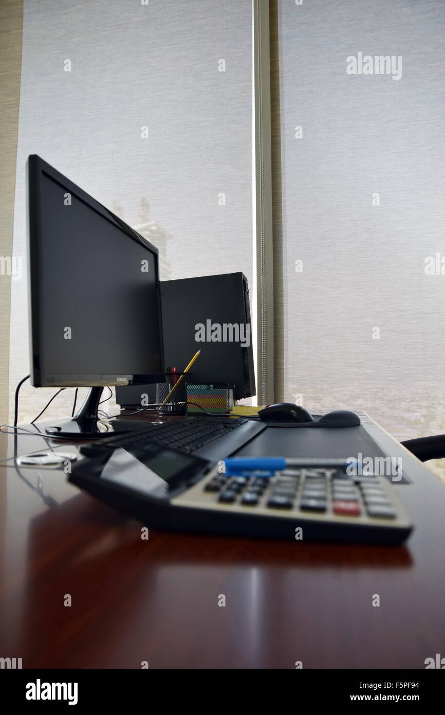 Office desk with computer and other items in the day Stock Photo