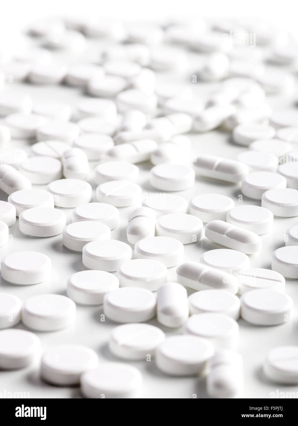 White pills, close up. Stock Photo