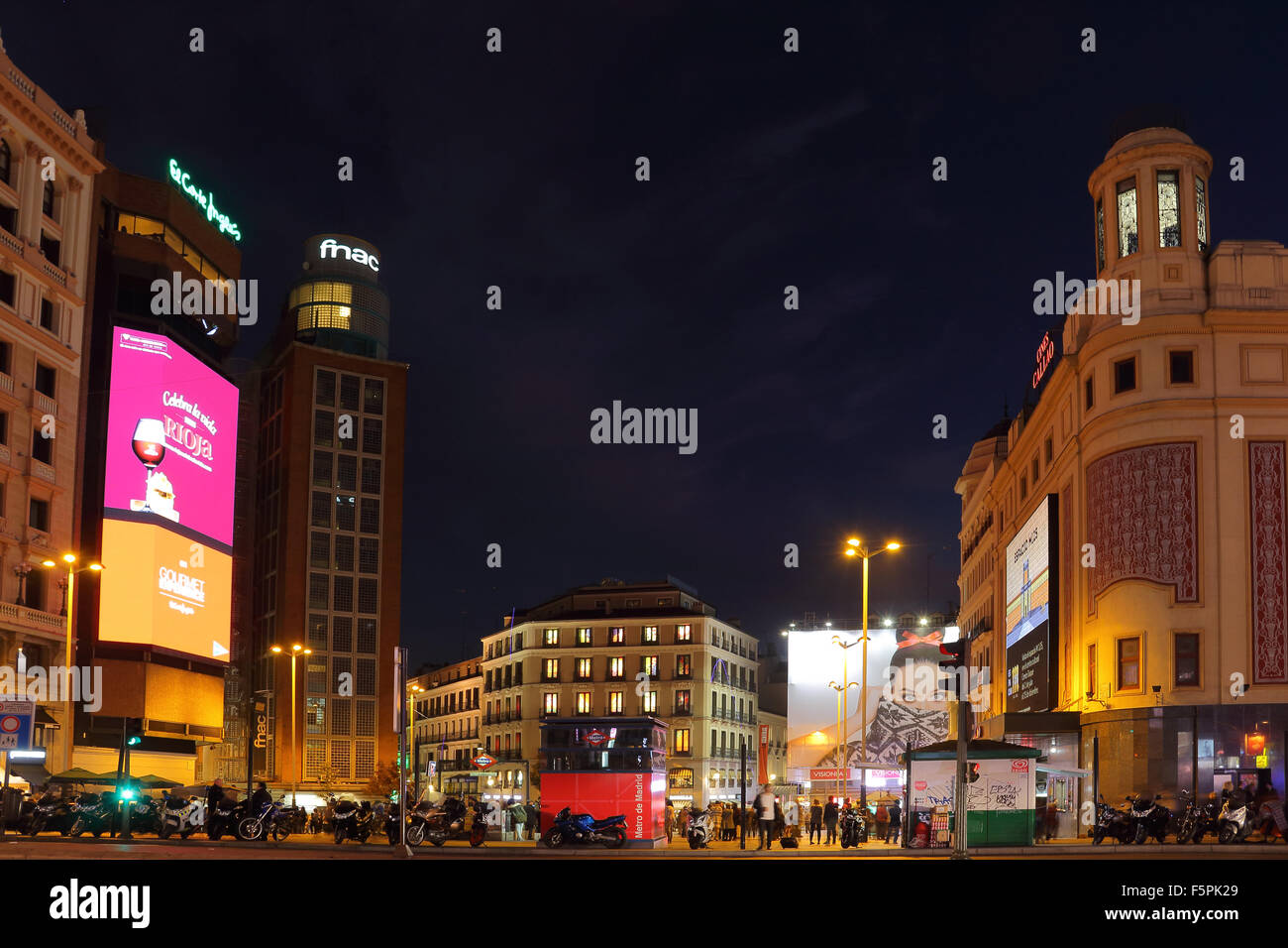 Night photo of Plaza Callao in Madrid, with the Cines Callao, FNAC, and El Corte Inglés buildings. Stock Photo