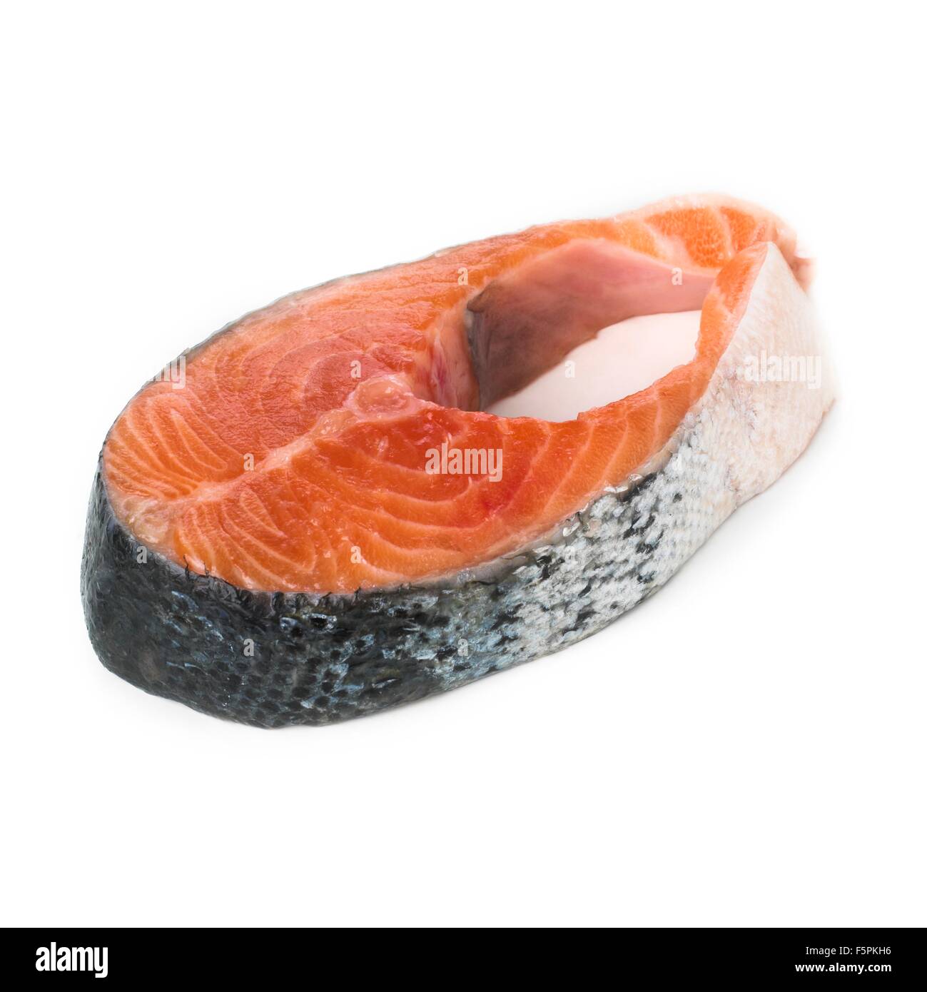 Salmon steak against a white background. Stock Photo
