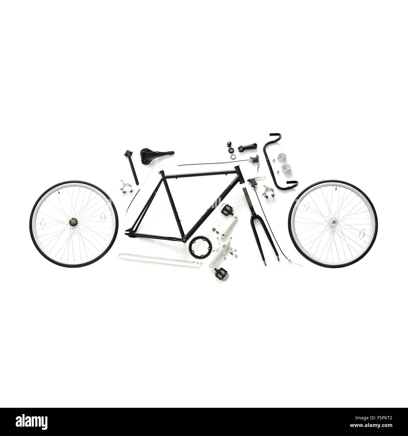 Components of a fixed-gear road bike against a white background. Stock Photo