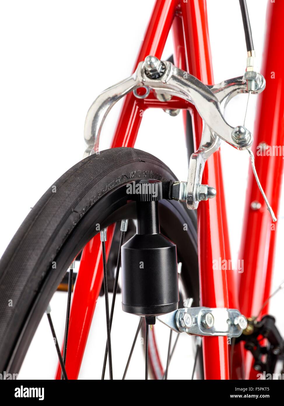 Bicycle dynamo fixed to the back wheel, close up. Stock Photo