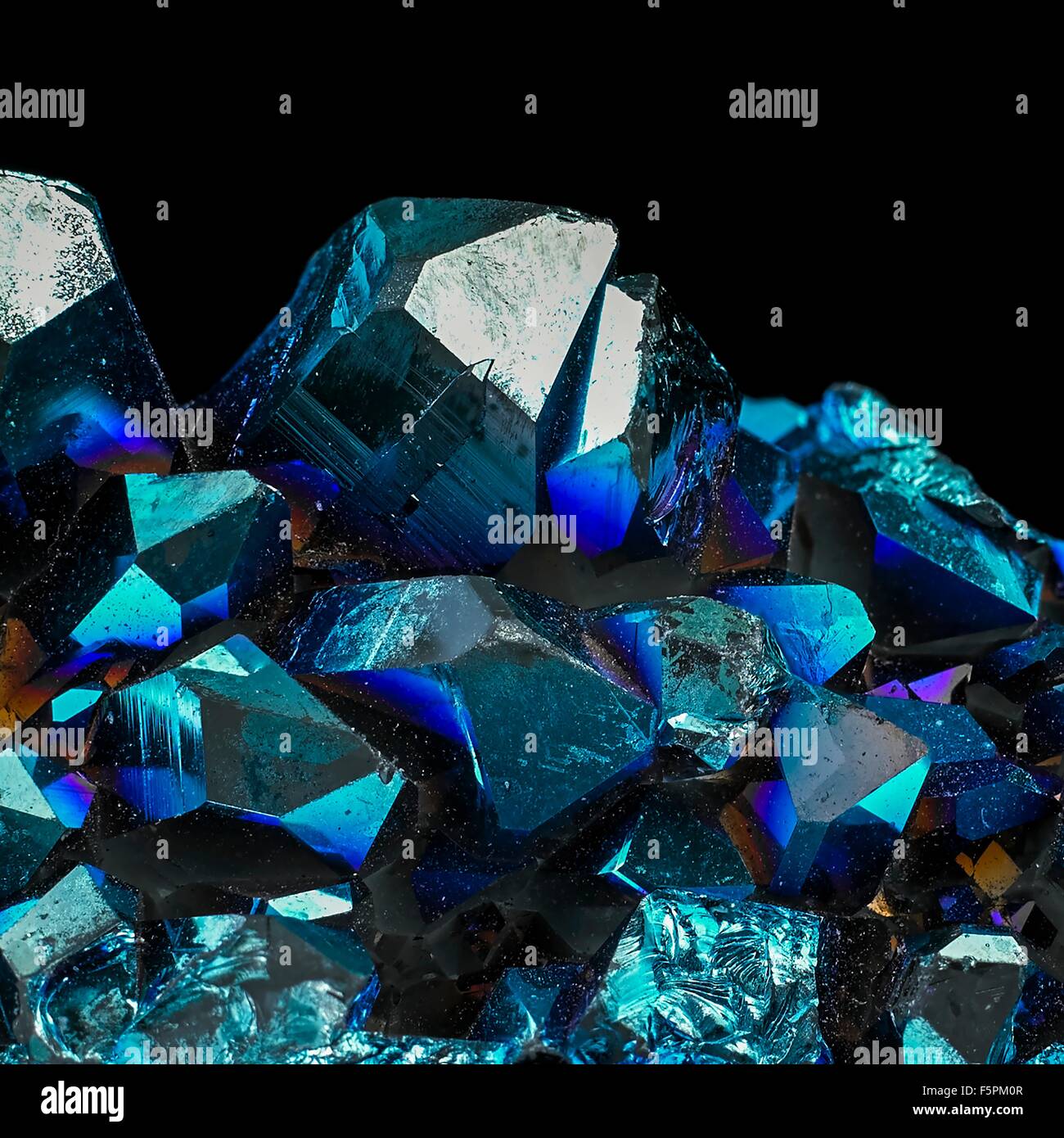 Titanium quartz against a black background. These quartz crystals have