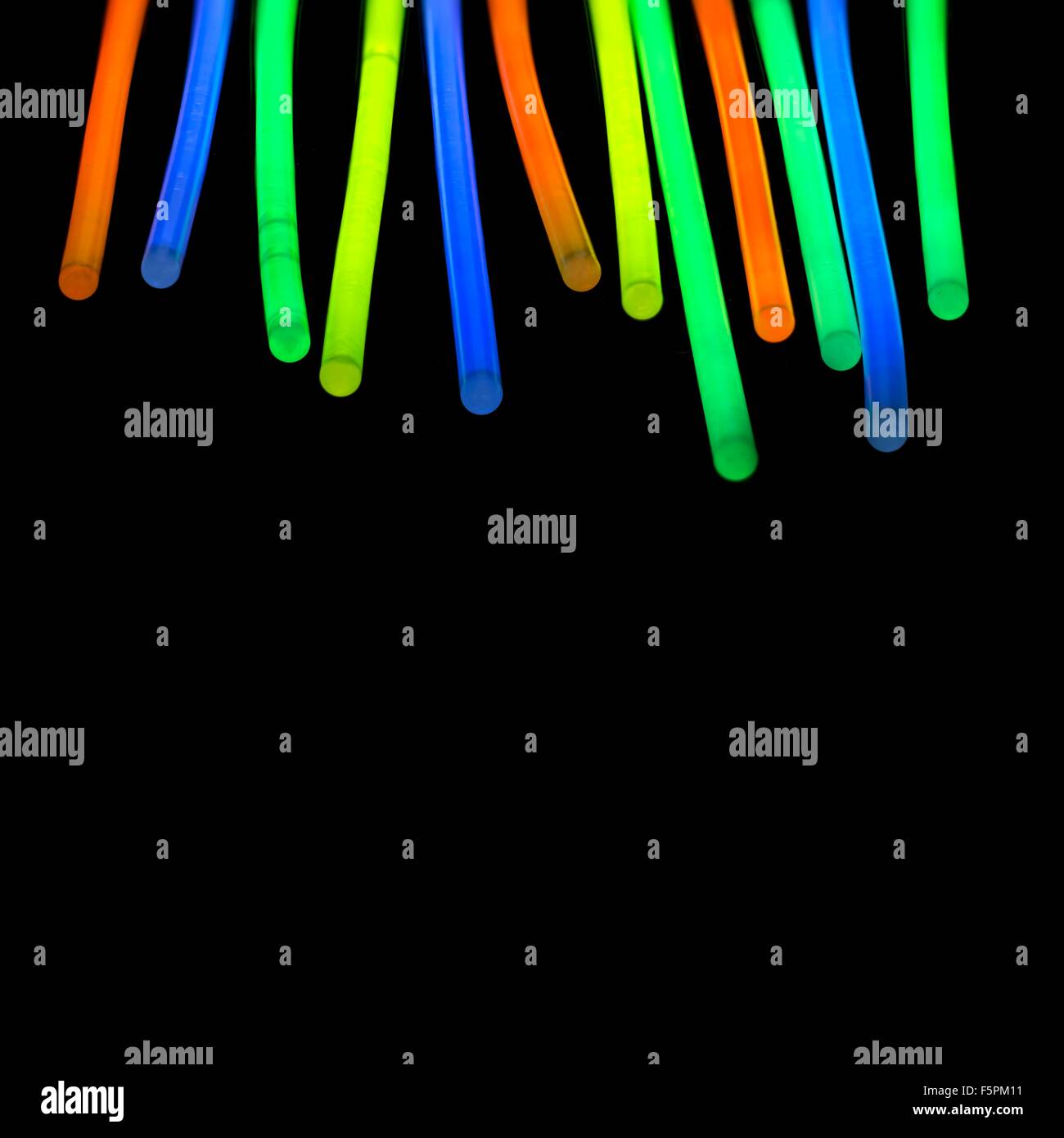 Glow sticks against a black background. Stock Photo