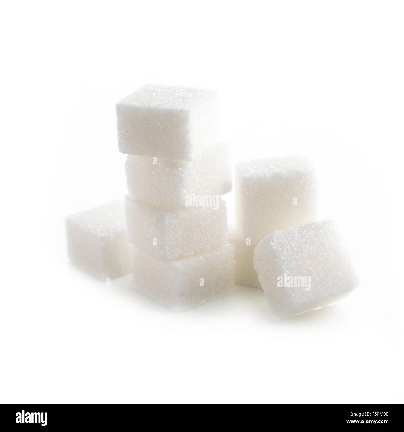 Sugar lumps against a white background Stock Photo - Alamy