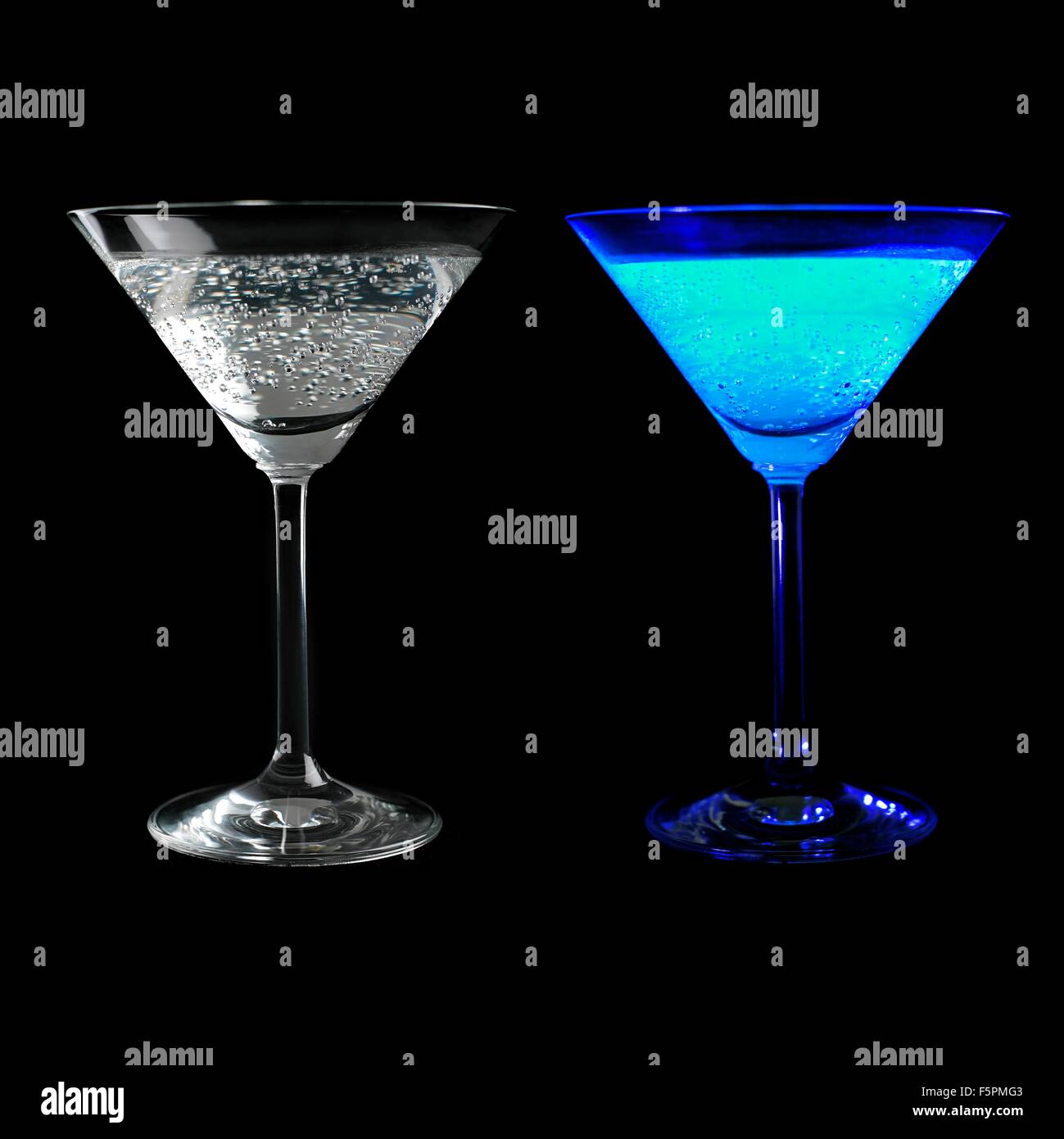 Tonic water fluorescing. A glass of tonic water seen under visible