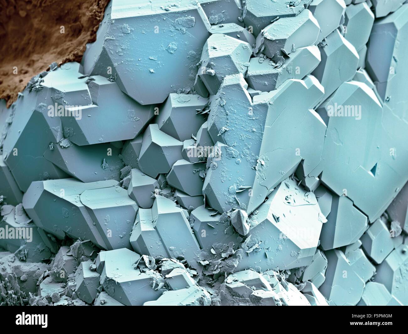 Quartz crystals, coloured scanning electron micrograph (SEM). This silicate mineral is a form of silica (silicon dioxide). Stock Photo