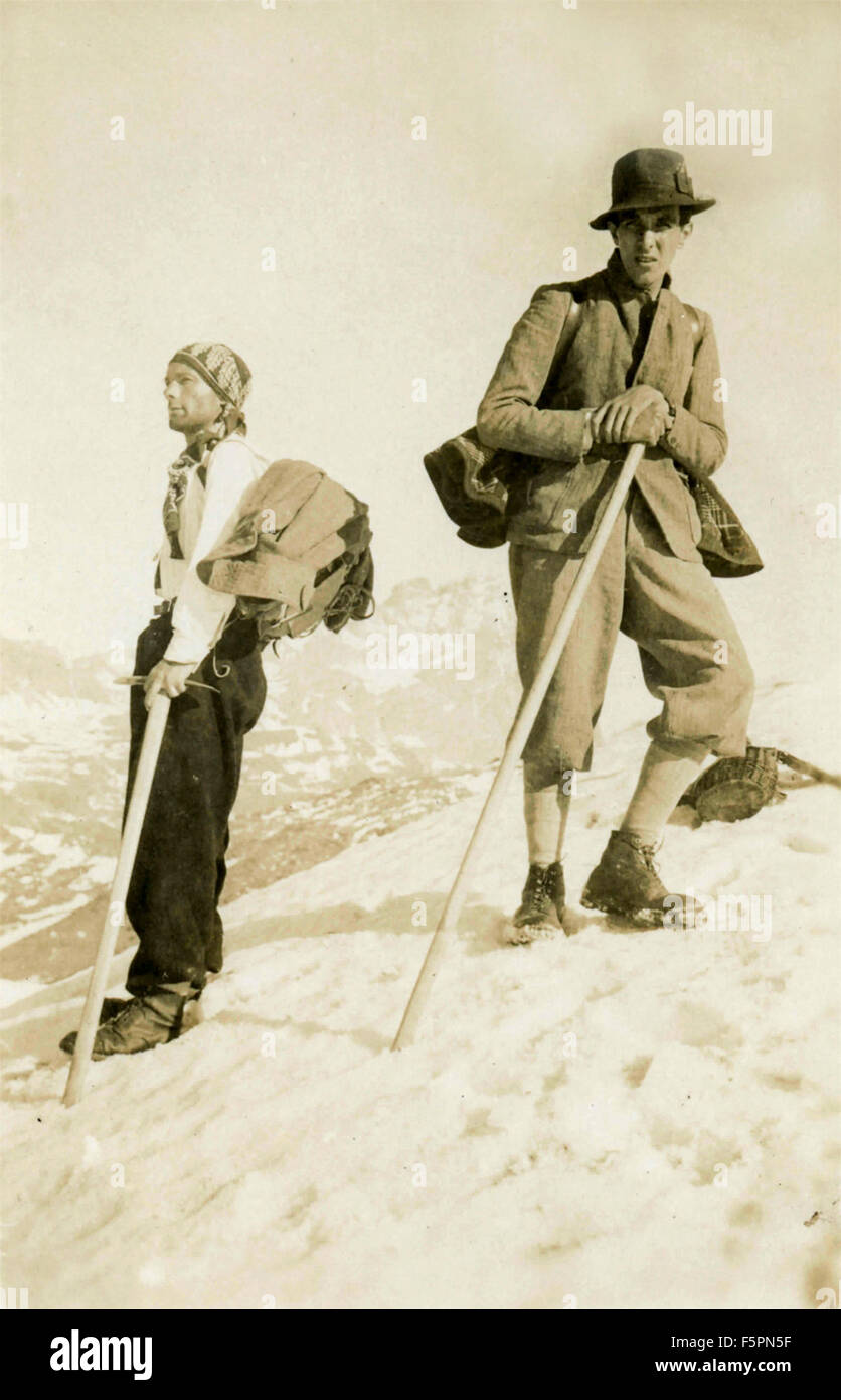 Two men climb a mountain Stock Photo - Alamy