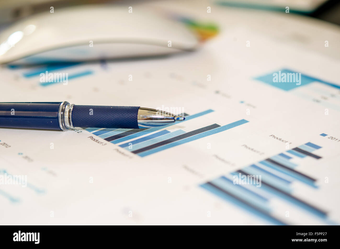 Workplace with keyboard and graphs. Stock Photo