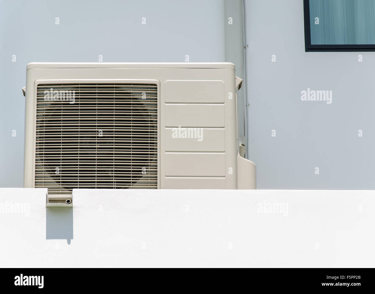 Air compressors unit is outside the office building. Stock Photo