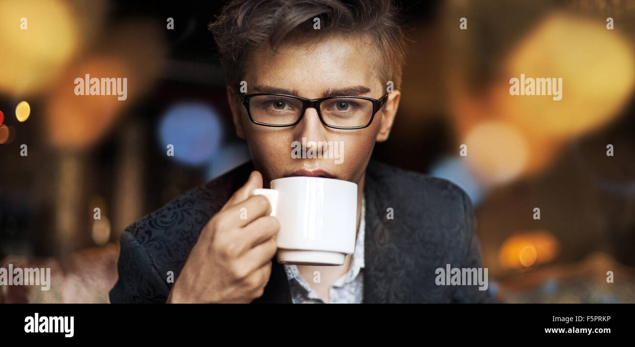 Elegant guy drinking an aromatic coffee Stock Photo Alamy
