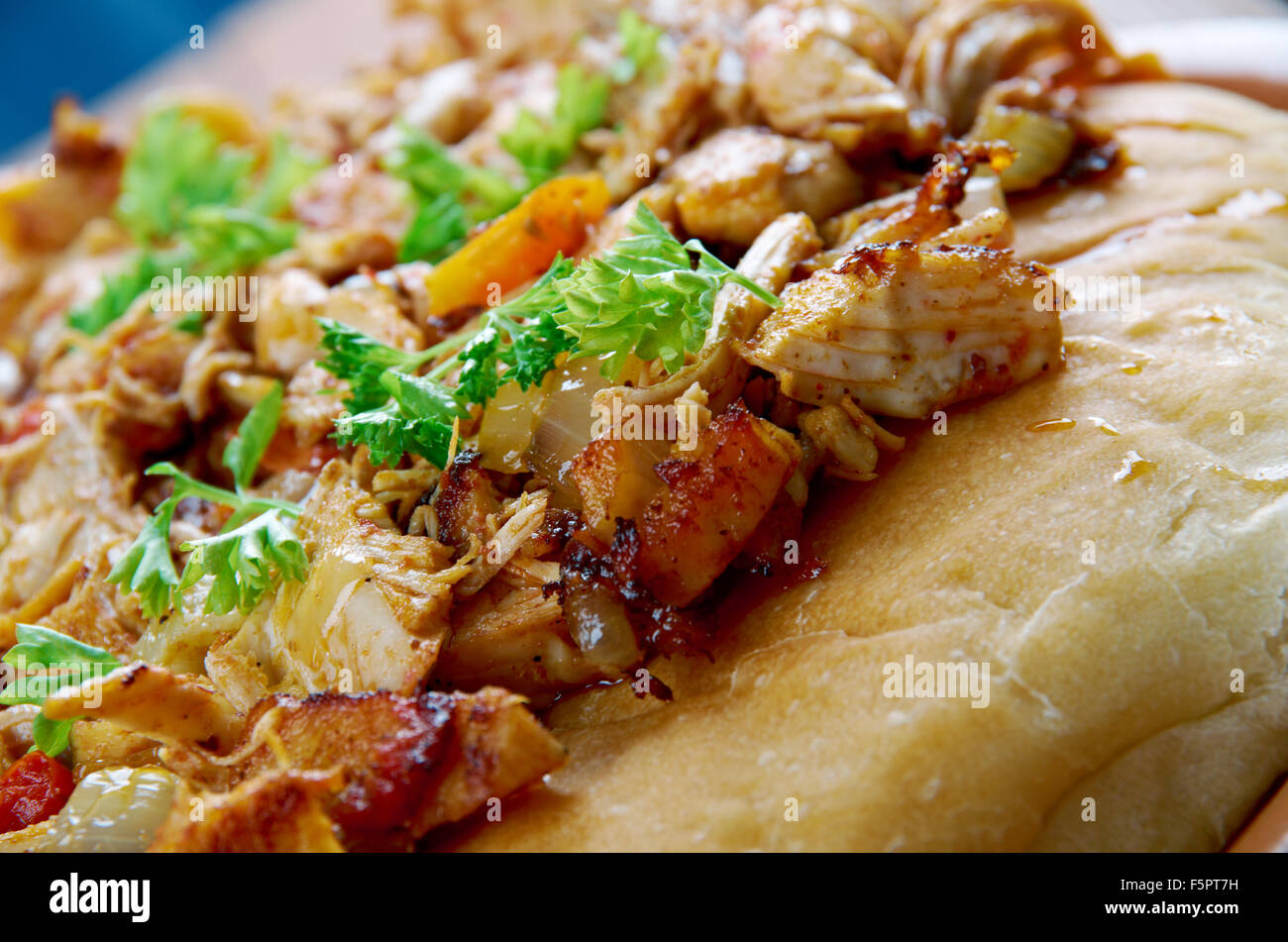 Musakhan -  Jordanian and Palestinian dish.roasted chicken baked with onions, sumac, allspice, saffron, served over taboon bread Stock Photo