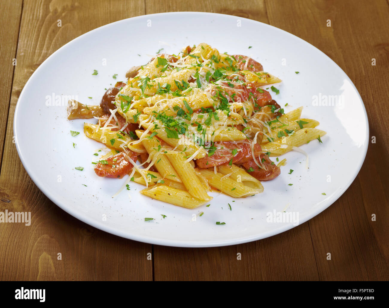 Italian Penne rigate pasta with sausage,perish Stock Photo - Alamy