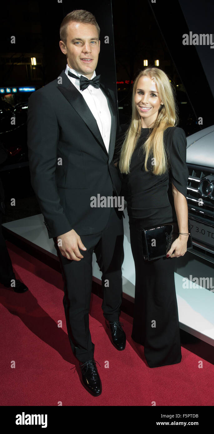 Berlin, Germany. 7th Nov, 2015. Germany goalkeeper Manuel Neuer and girlfriend Nina arrive at the 22nd opera gala for the Deutsche Aids-Stifung (German AIDS foundation) in Berlin, Germany, 7 November 2015. Around 2000 guests and several celebrities attended. PHOTO: JOERG CARSTENSEN/DPA/Alamy Live News Stock Photo
