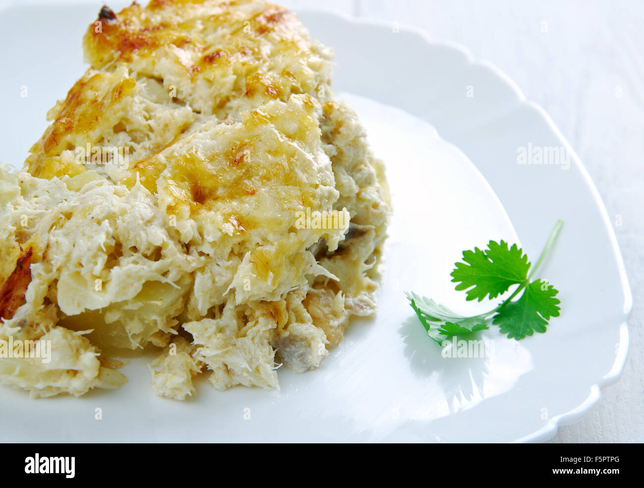 Bacalhau com natas Fish casserole with potatoes. Portuguese cuisine