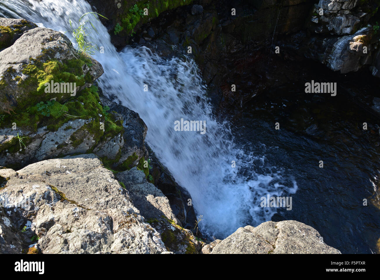 Putorana Plateau, a waterfall on the Grayling Stream. Mountain stream on a  cloudy day Stock Photo - Alamy