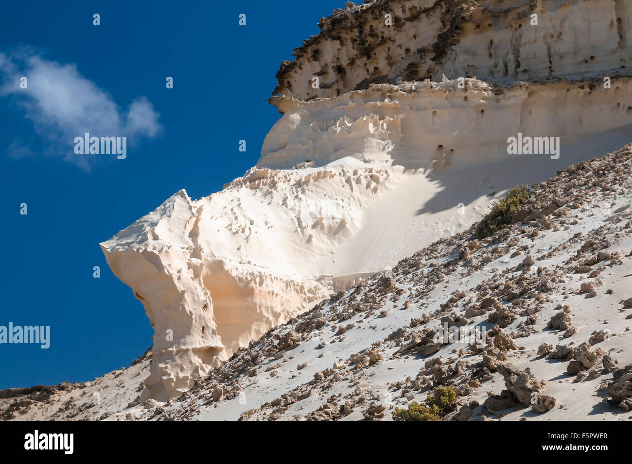 Eroding rock formations with holes in Jandia, Fuerteventura Stock Photo