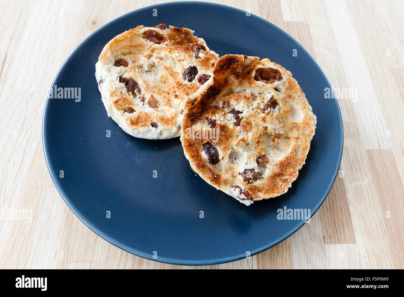 Hot toasted tea cakes on a blue plate Stock Photo Alamy