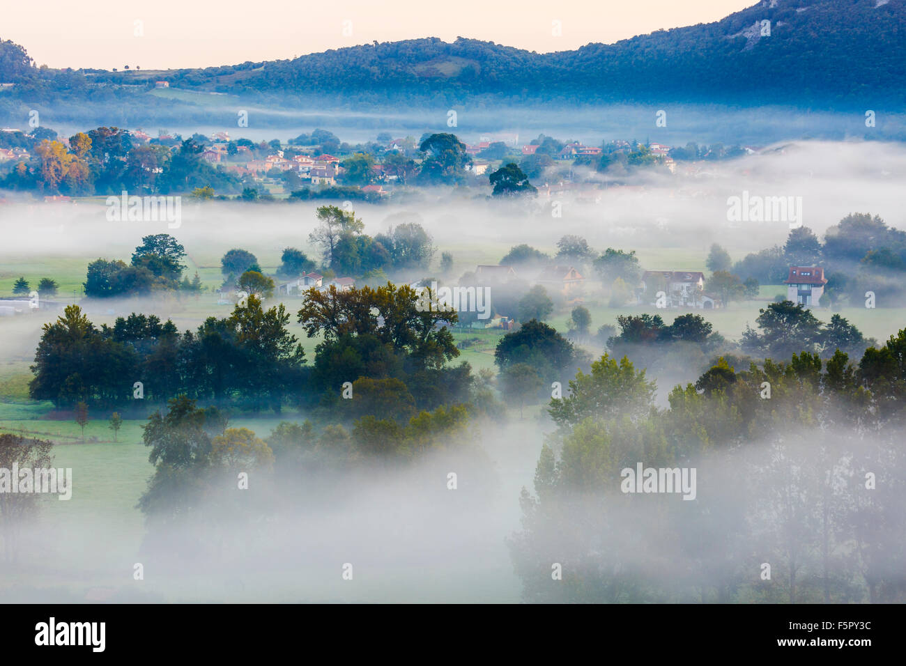 Fog at dawn. Liendo Valley. Cantabria, Spain, Europe. Stock Photo