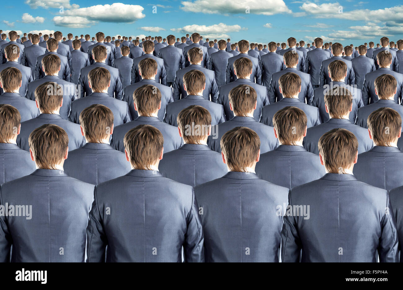 Rear view of many identical businessmen clones Stock Photo