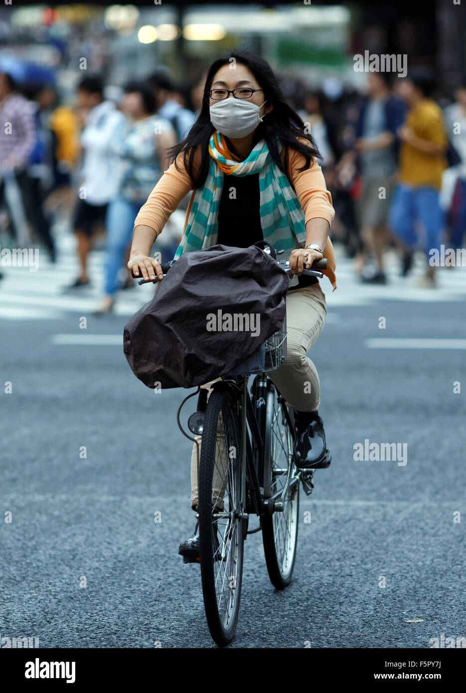 Japanese woman wearing face mask Stock Photo