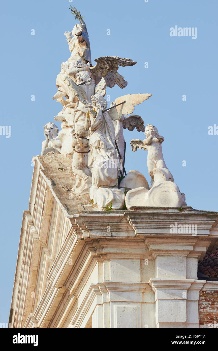 Sculpture group on the roof of Chiesa Di Santa Maria Assunta known as I Gesuiti Cannaregio Venice Veneto Italy Europe Stock Photo