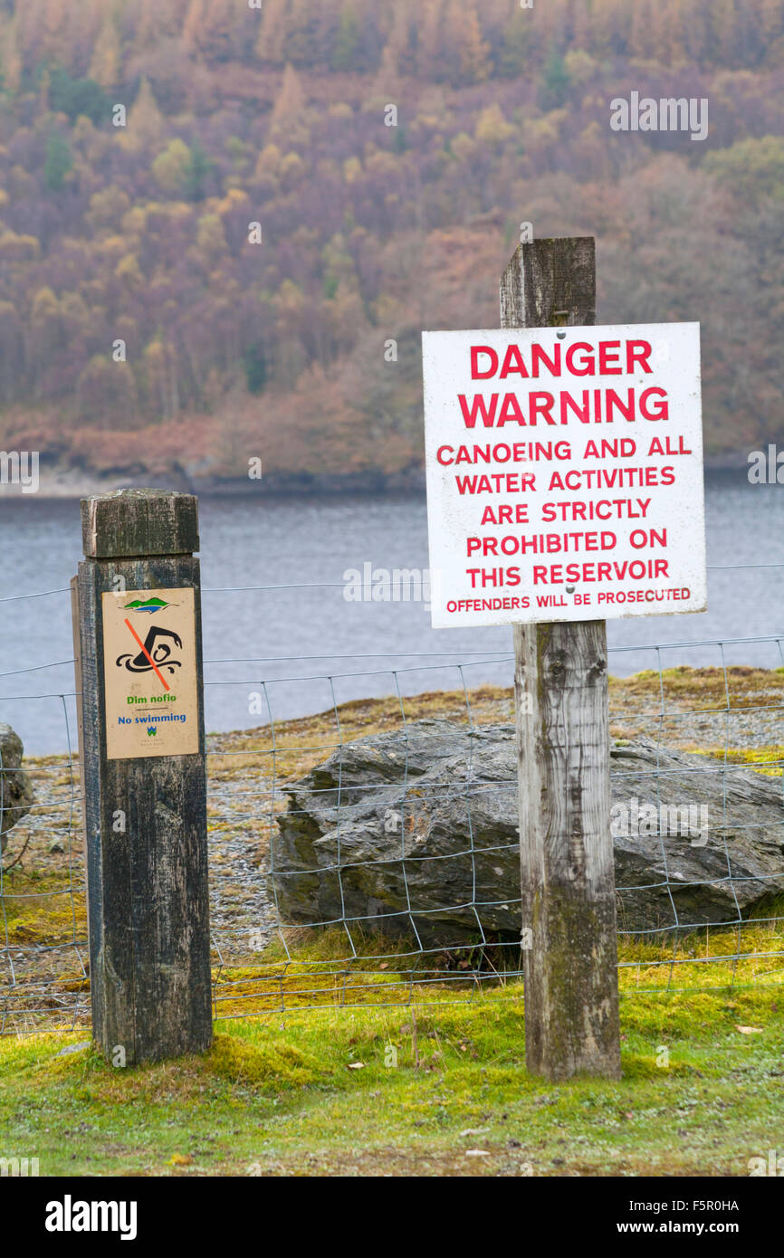 Danger warning canoeing and all water activities are strictly prohibited on this reservoir sign at upper Llyn Brianne Dam, Mid Wales, UK in November Stock Photo