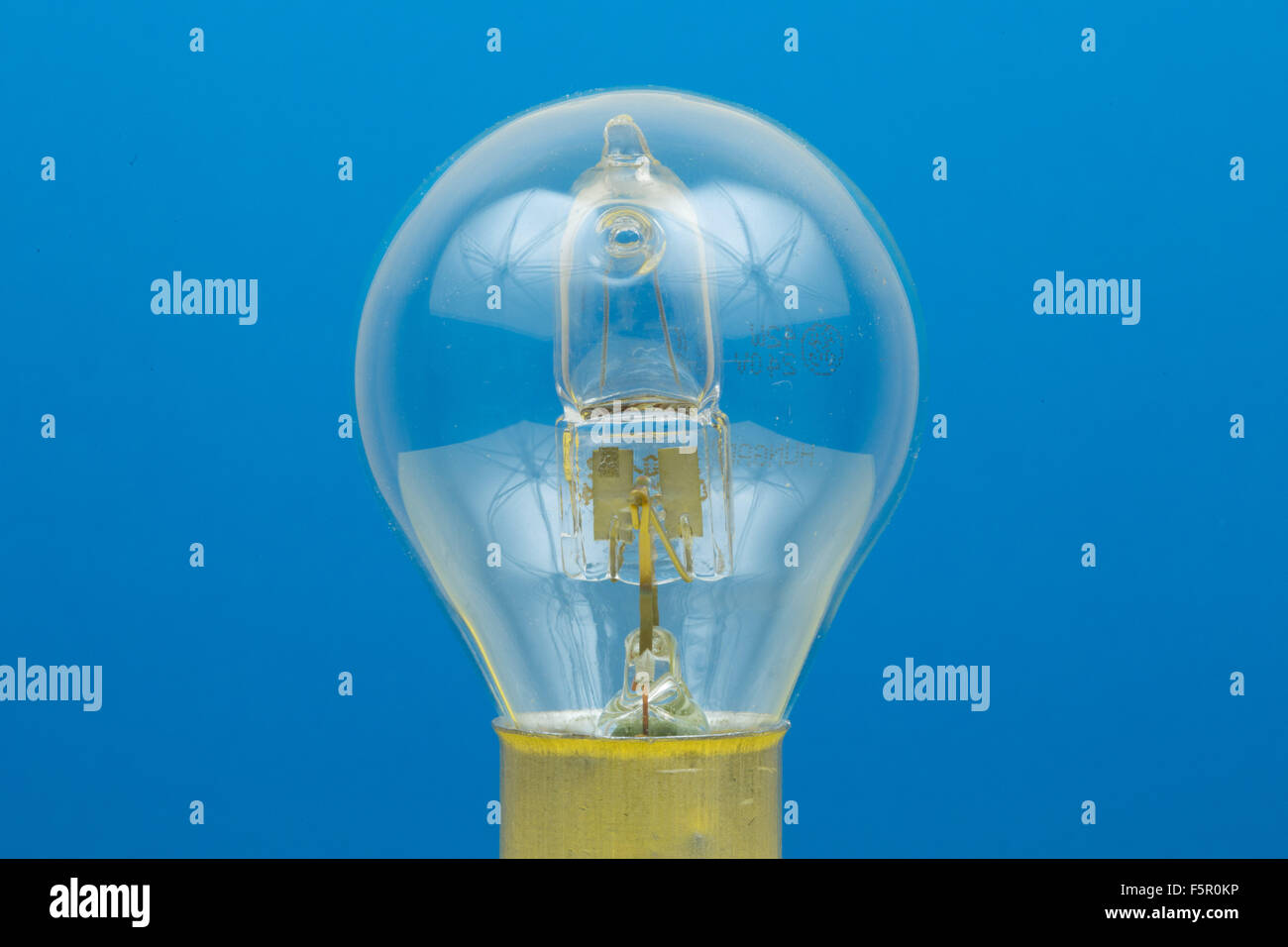 A light bulb on a blue background Stock Photo - Alamy
