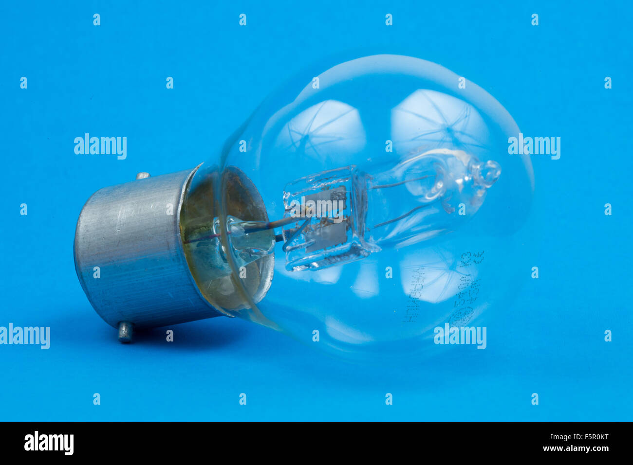 A light bulb on a blue background Stock Photo - Alamy