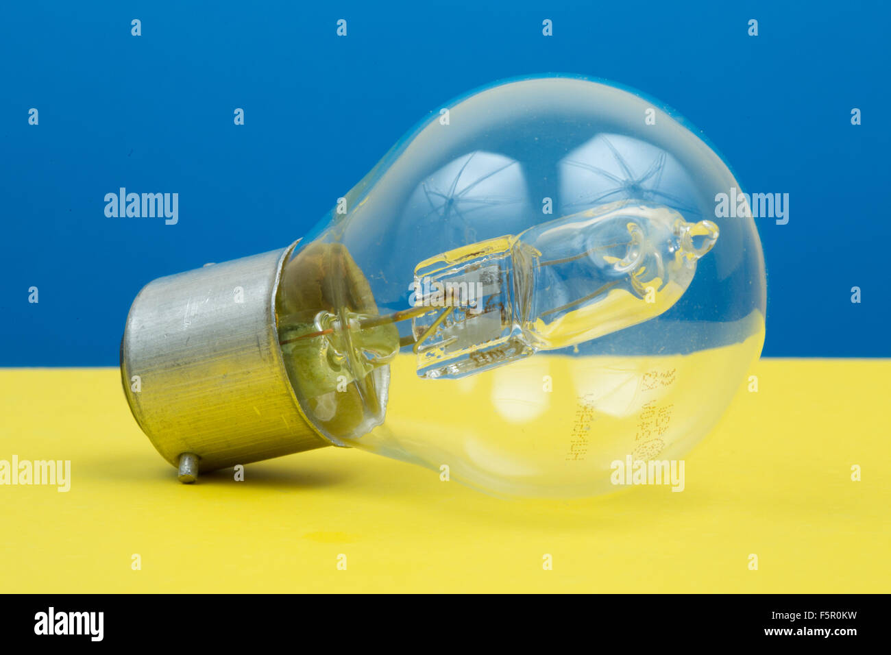 A light bulb on a coloured background Stock Photo Alamy