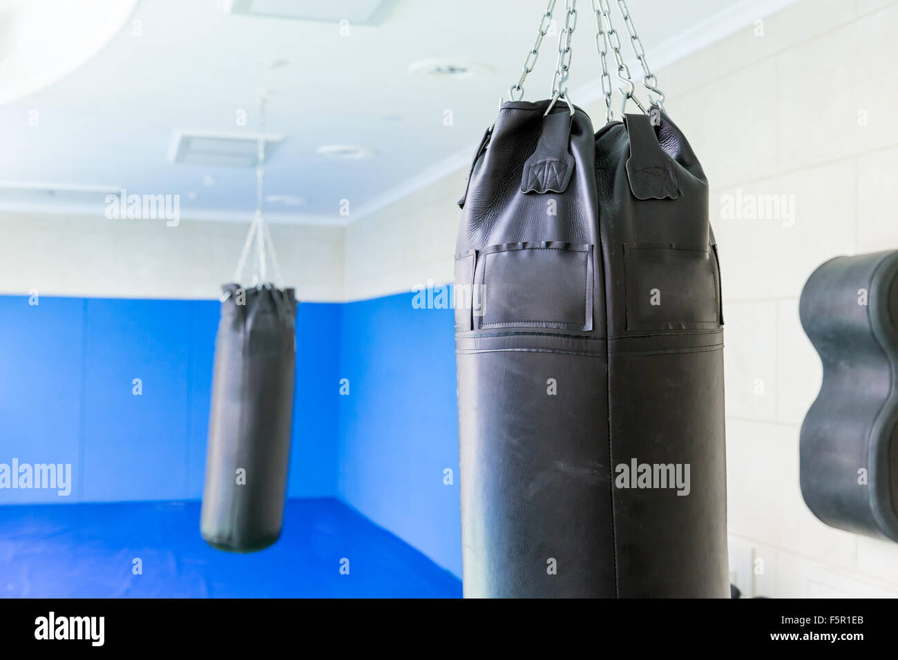 Black punching bag in the gym close up Stock Photo Alamy