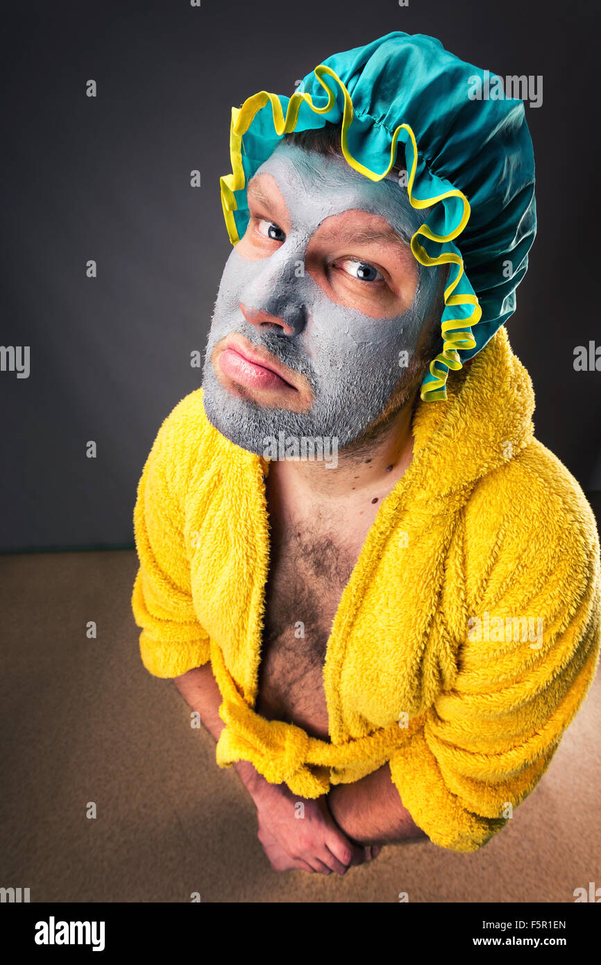 Sad freak man in bathrobe Stock Photo