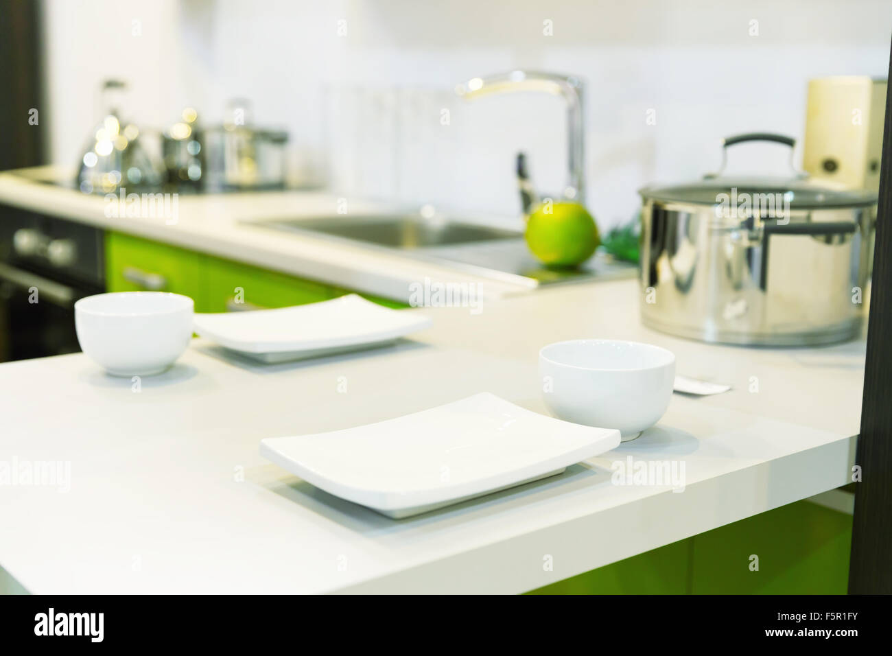 Empty white plates over plastic white table closeup Stock Photo Alamy