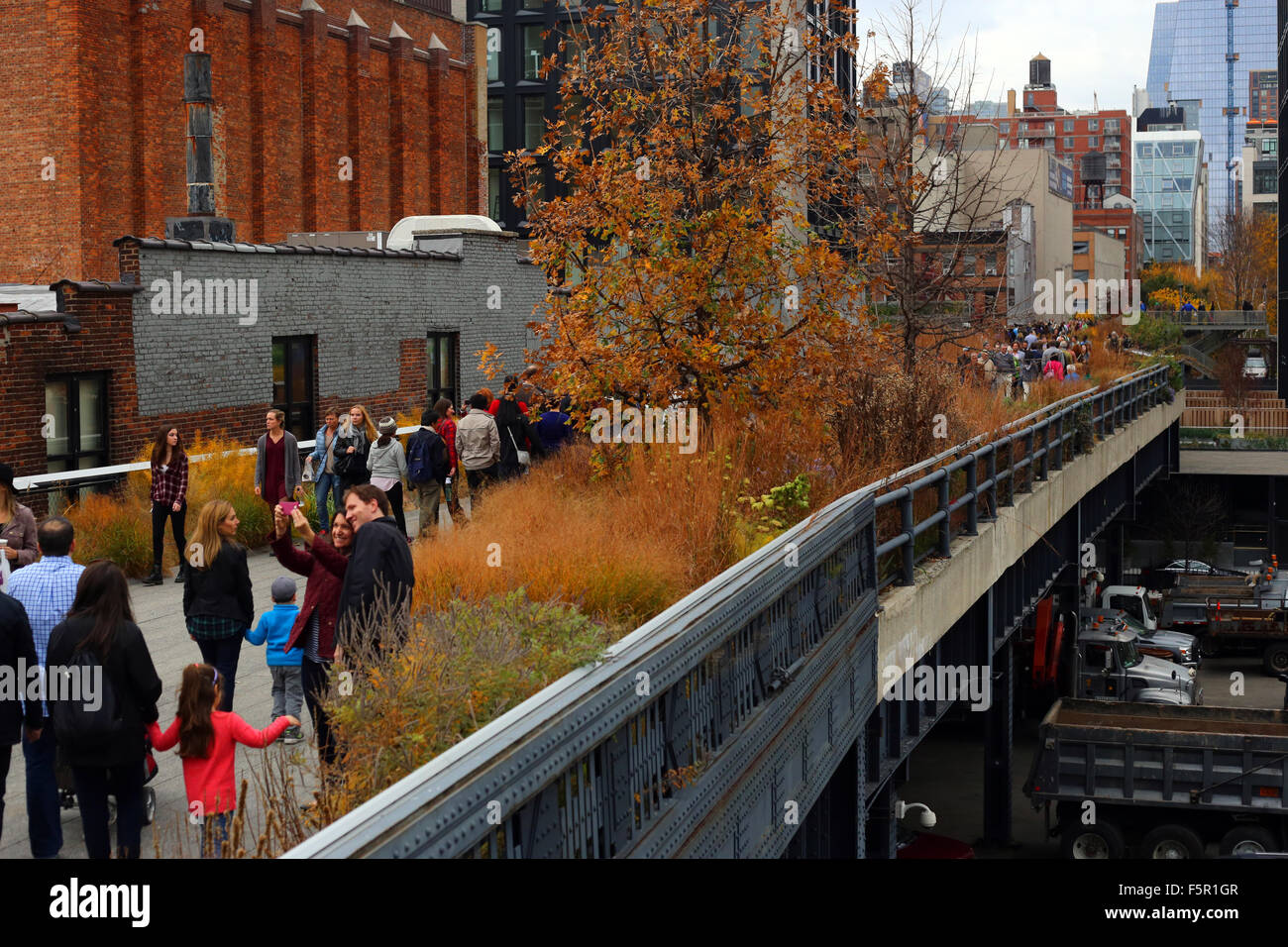 Tourists on a section of High Line elevated park, New York, NY. The
