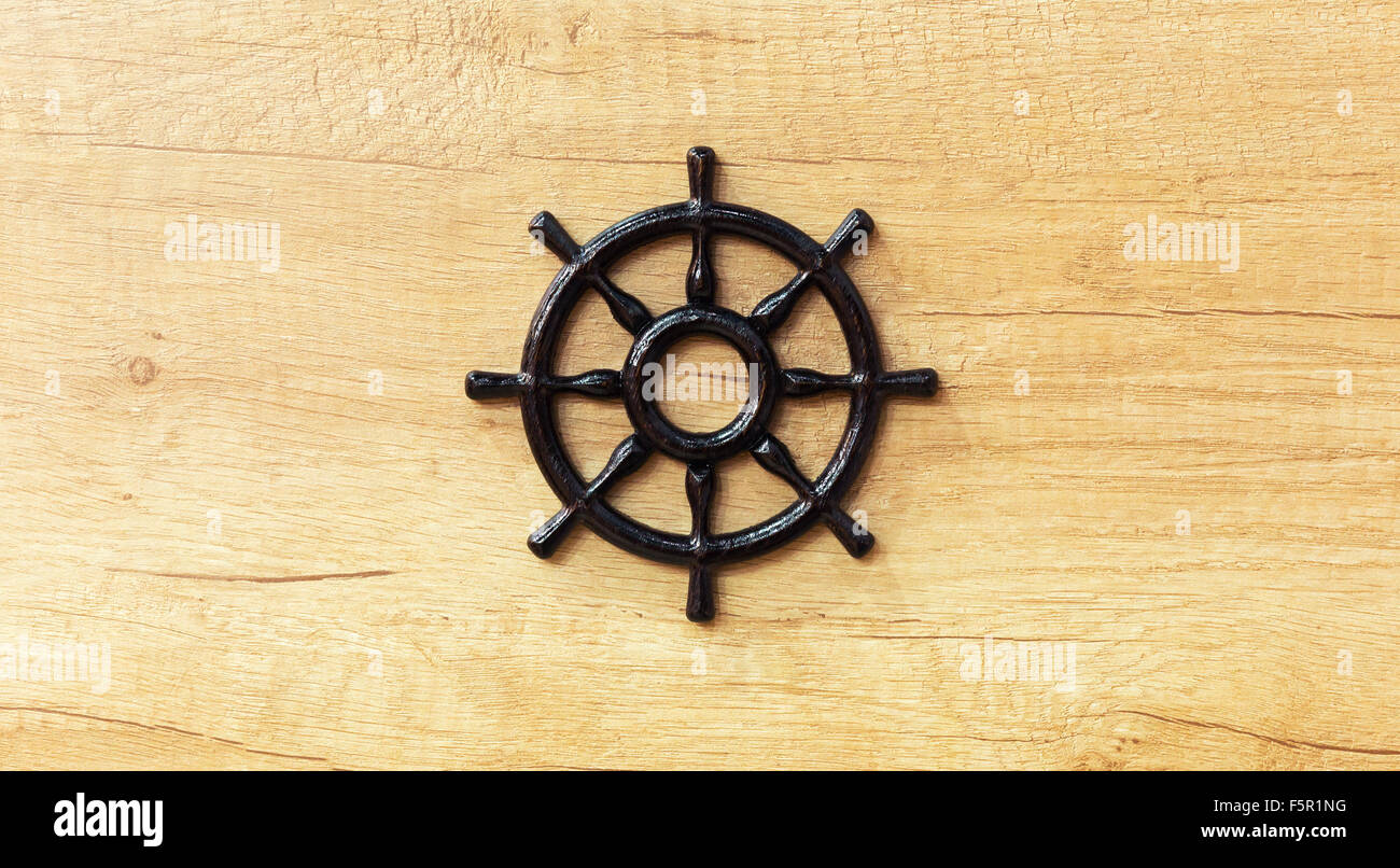 Beautiful ship steering wheel on wooden background Stock Photo - Alamy