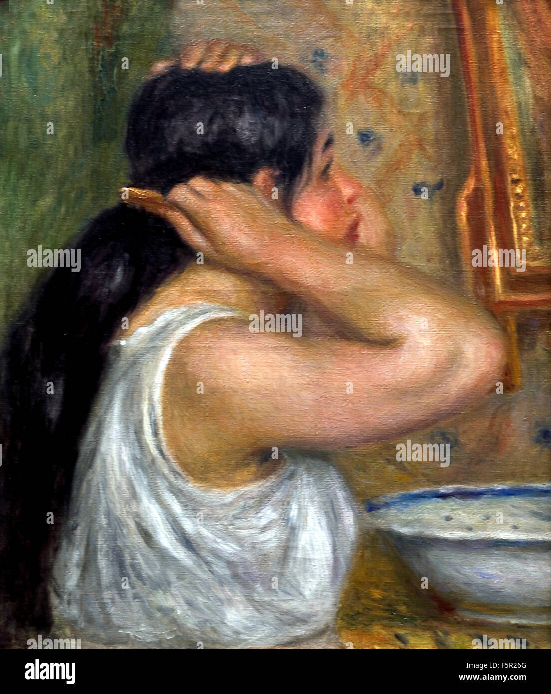 La toilette : femme se peignant - The toilet: woman painting 1907 - 1908  Pierre Auguste Renoir 1841-1919 French Impressionist France Stock Photo