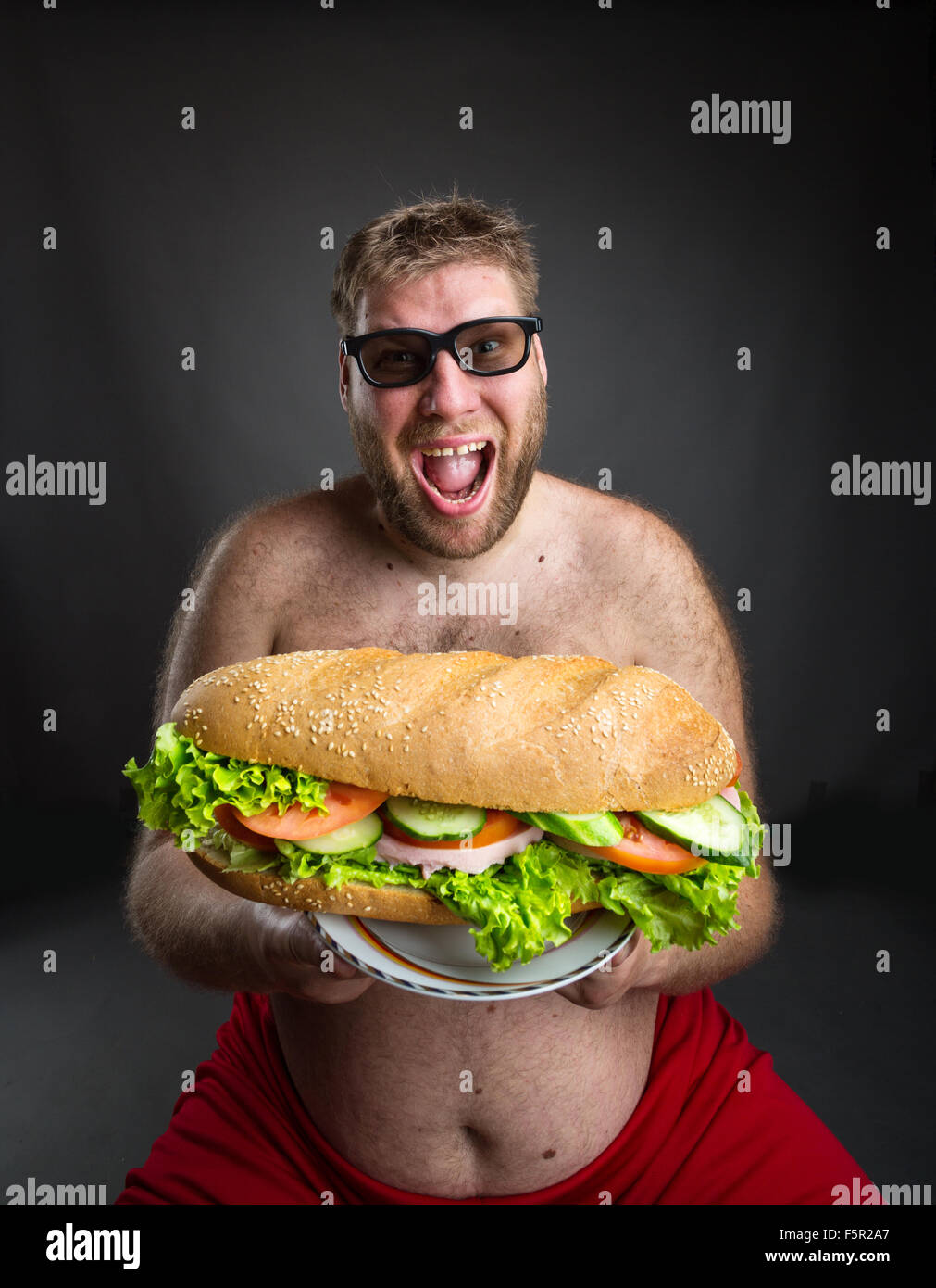 Fat happy man in glasses hi-res stock photography and images - Alamy