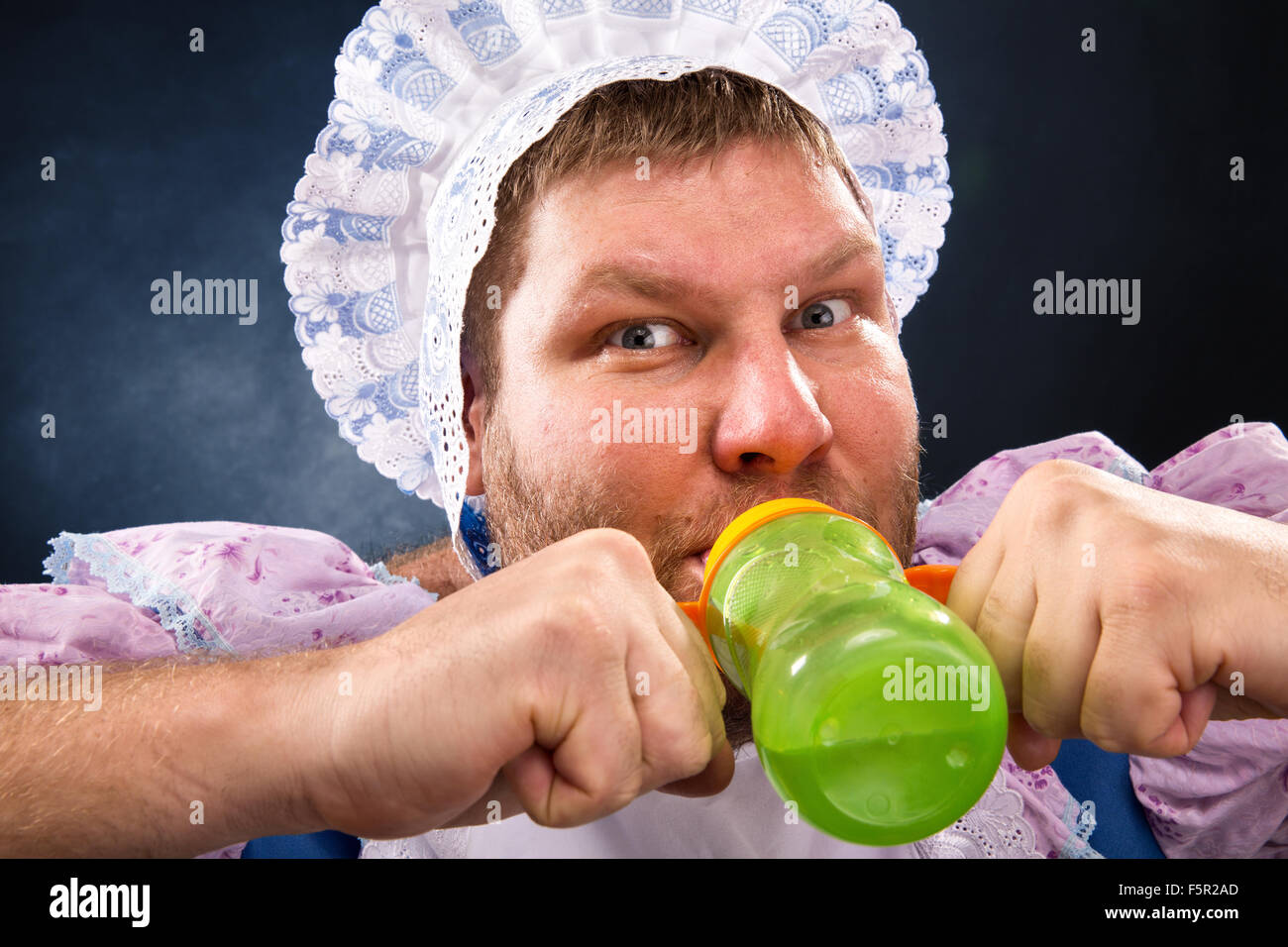 Crazy man sucking baby bottle Stock Photo Alamy Crazy man sucking baby bottle Stock Photo Alamy
