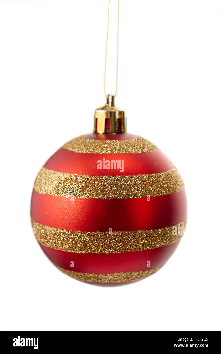 Sparkly gold and red striped christmas ball isolated on white background Stock Photo